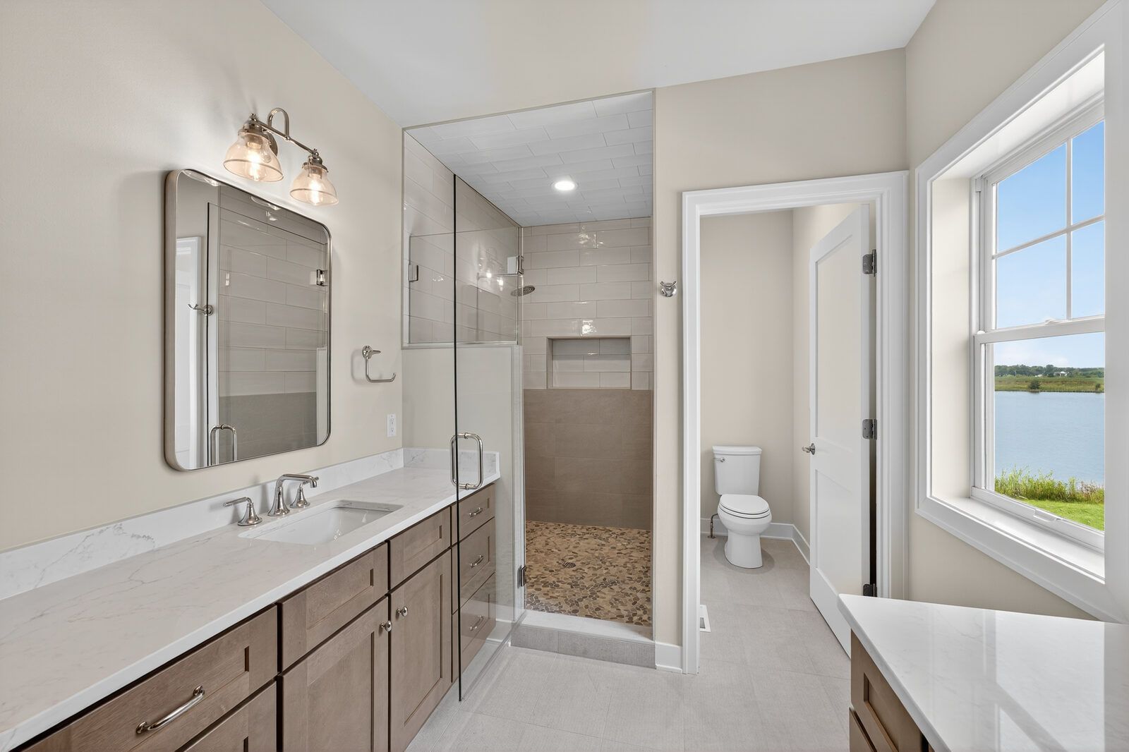 Bathroom remodel with a lake view window by Corinth