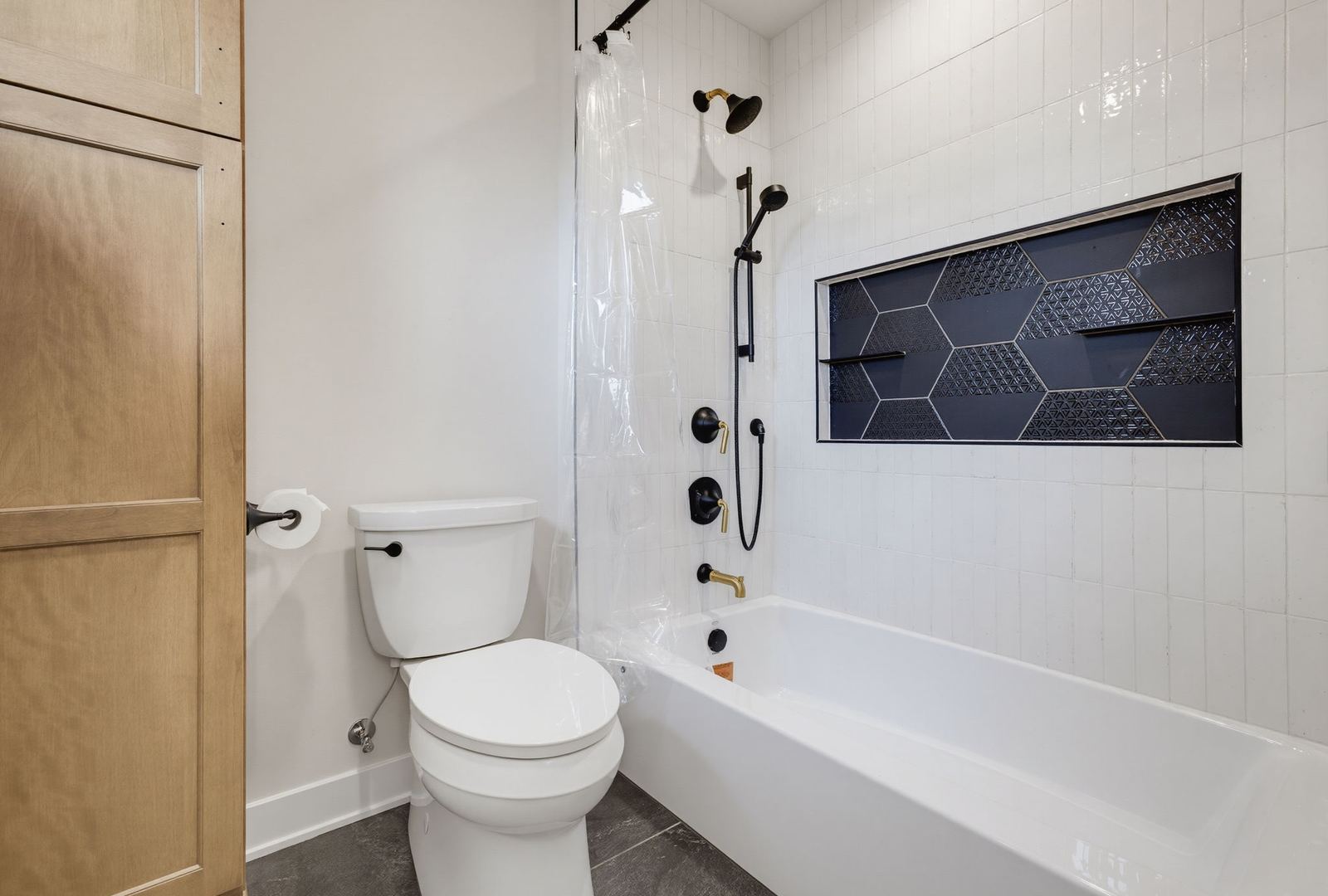 Shower and Tub Installation in a basement remodeled by Corinth Basement Remodeling